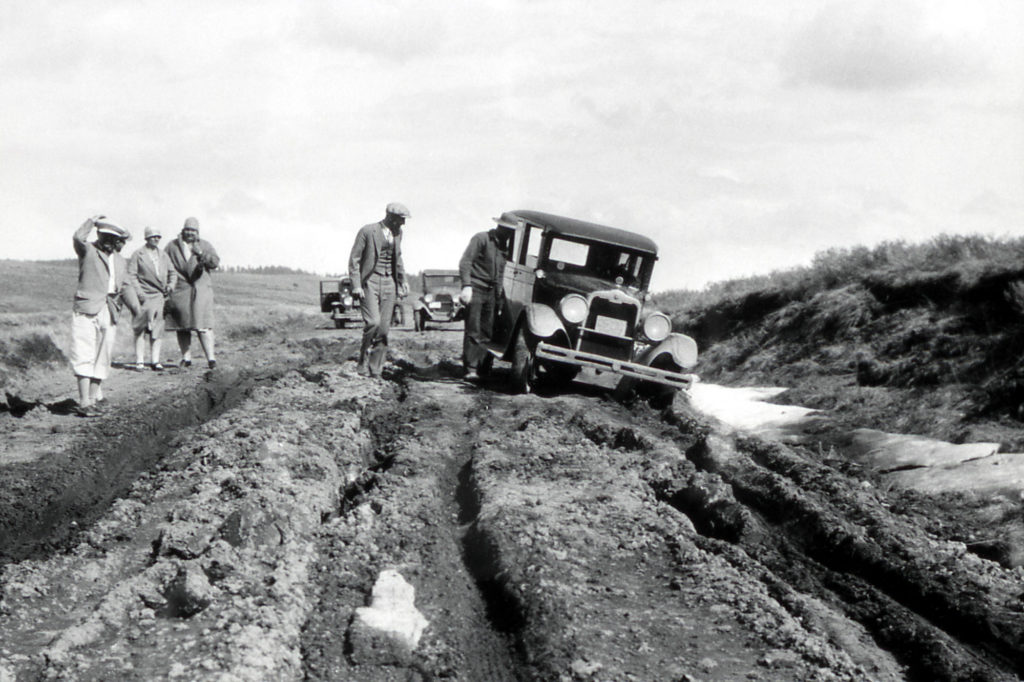 1925 automobile stuck in dirt road; Photographer unknown; 1925